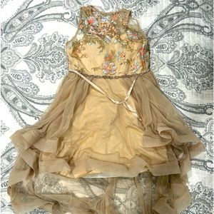 A gold dress from Macy’s with gray accents. Girls size 10-12